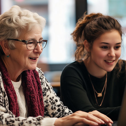 Elderly woman and young woman at a desktop